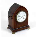An Edwardian Maple and Co. Ltd. mahogany cased mantel clock, of lancet form with boxwood edging and ... 