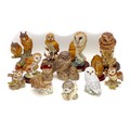 A group of twelve large owl figurines, including three Mack figurines,  'Little Owl', 11.5 by 9 by 8... 