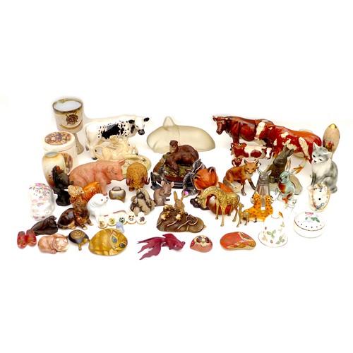 17 - A menagerie of animal figurines and collectables, including ceramic cattle figurines without maker's... 