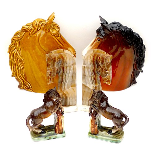 14 - A collection of six equine ornaments, comprising two horse head busts, the largest, treacle glazed, ... 