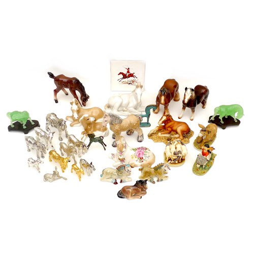 15 - Over twenty-five late 20th century horse figurines, including a Beswick style pony,13 by 4 by 12.5cm... 