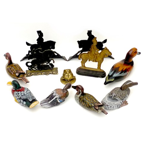 219 - Four door stops, one bulldog knocker, and six wooden ducks, black-painted doorstops 32 by 5 by 24 cm... 