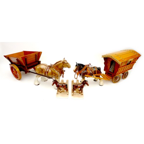 12 - A group of china animal figurines, comprising two modelled as horses pulling a wooden cart and a car... 