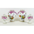 A pair of Meissen Neo-Classical small vases, likely 19th century, the urn shaped form modelled with ... 