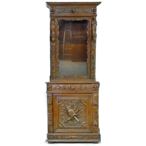 355 - A late 19th century Continental oak bookcase, profusely carved with figures, leaves, and swags, with... 