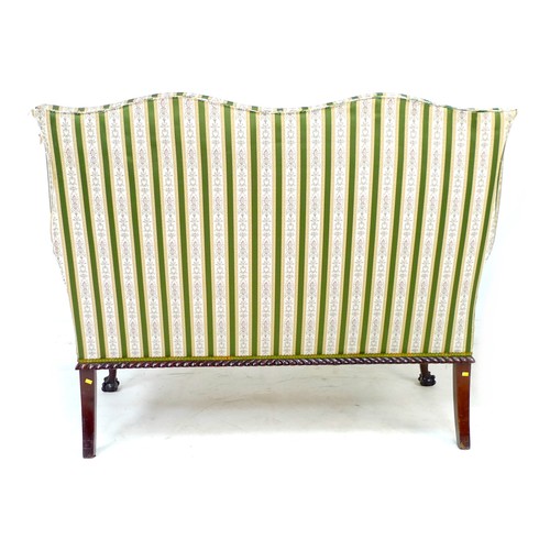 353 - A Victorian wing settee, two seater, high back, upholstered in striped dark green and gold floral em... 