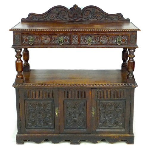 345 - A late Victorian oak buffet, with carved decoration, upper tier with drawers, lower section with cup... 