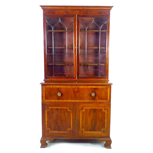 352 - A George III mahogany, crossbanded, and inlaid secretaire bookcase, raised on ogee bracket feet, 110... 