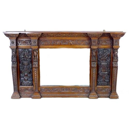 332 - A carved oak overmantel mirror, the bevelled rectangular plate flanked by carved panels and four bus... 