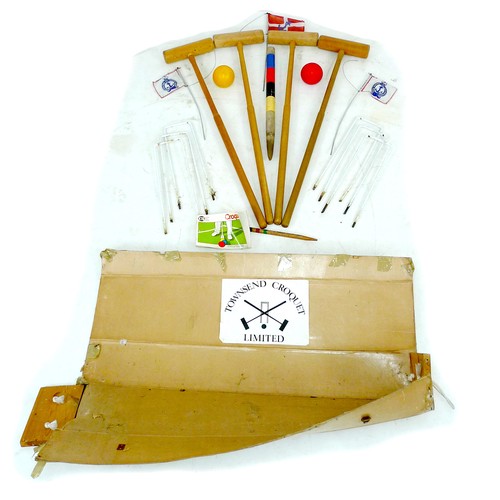 261 - A Townsend croquet set, circa 1990, in damaged cardboard box, with four mallets, two plastic balls, ... 