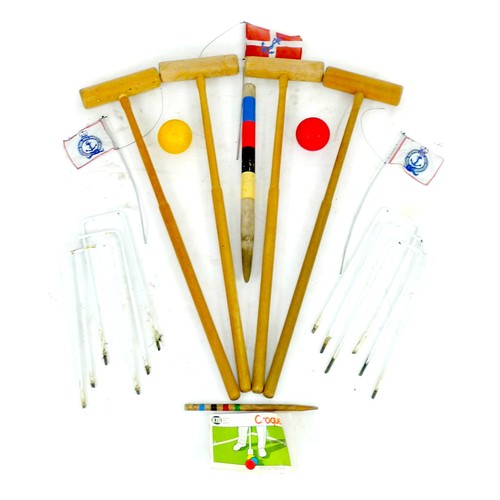 261 - A Townsend croquet set, circa 1990, in damaged cardboard box, with four mallets, two plastic balls, ... 