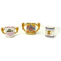 A group of three commemorative cups, comprising a Paragon limited edition loving cup, with lion hand... 