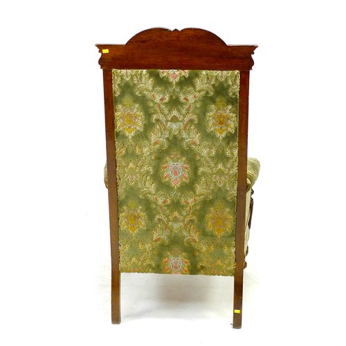 335 - A Victorian oak show frame armchair, with green upholstered back, armrests, and seat, 67 by 81 by 11... 