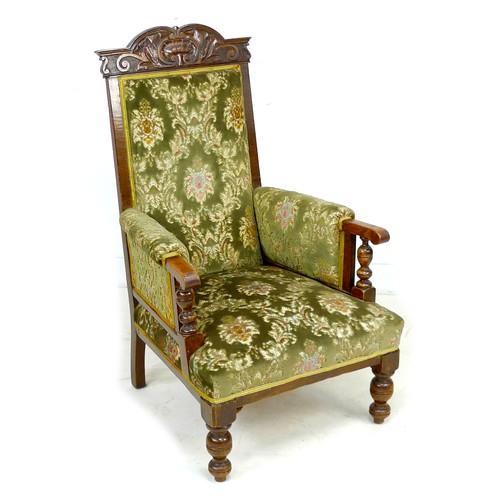 335 - A Victorian oak show frame armchair, with green upholstered back, armrests, and seat, 67 by 81 by 11... 