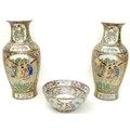 A pair of 20th century Chinese Canton porcelain baluster vases, typically decorated with reserves of... 