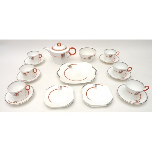 34 - An Art Deco Shelley part tea service, decorated with an abstract design in orange and grey against a... 