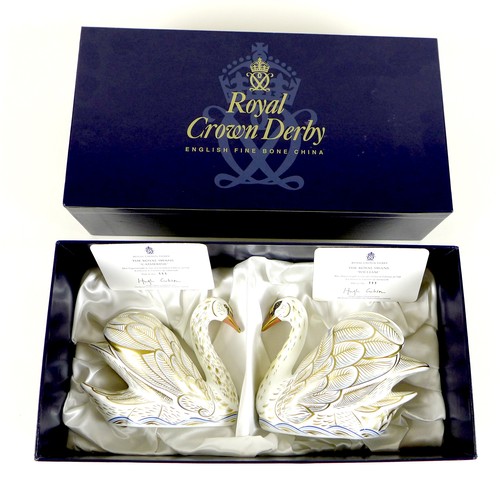 46 - A pair of Royal Crown Derby commemorative paperweights, modelled as 'The Royal Swans', 'William' and... 
