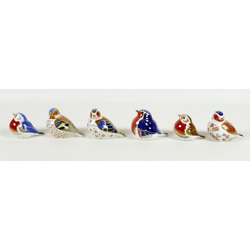 65 - A group of six Royal Crown Derby paperweights, all modelled as birds, comprising 'Anniversary Robin'... 