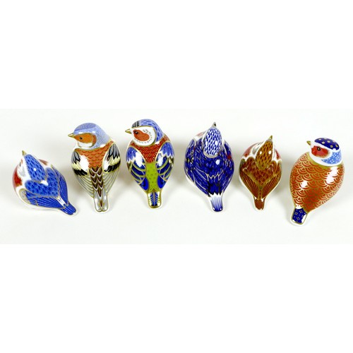 65 - A group of six Royal Crown Derby paperweights, all modelled as birds, comprising 'Anniversary Robin'... 