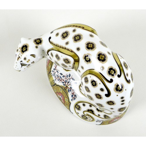 73 - A Royal Crown Derby paperweight, modelled as 'Snow Leopard', MMXII, gold stopper, 12.5cm high, boxed... 