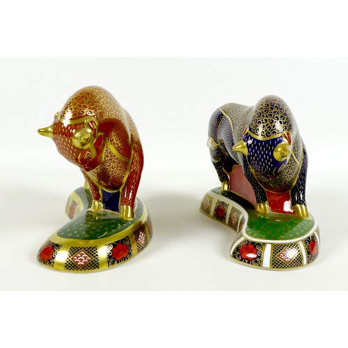 75 - Two Royal Crown Derby paperweights, modelled as 'Harrods Bull', one of a limited edition of 400 Spec... 