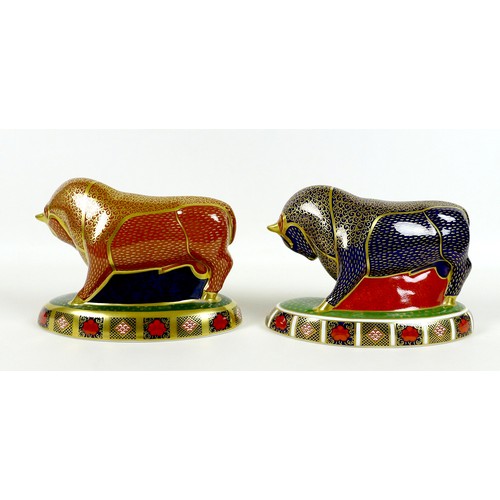 75 - Two Royal Crown Derby paperweights, modelled as 'Harrods Bull', one of a limited edition of 400 Spec... 