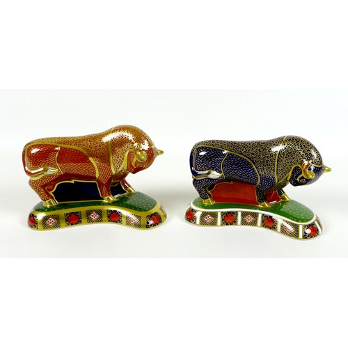 75 - Two Royal Crown Derby paperweights, modelled as 'Harrods Bull', one of a limited edition of 400 Spec... 