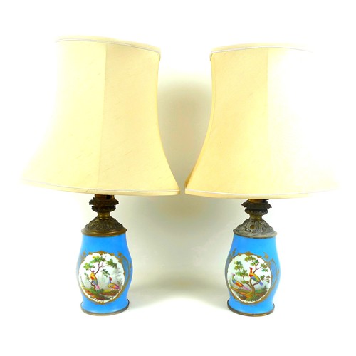 141 - A pair of Sevres style table lamps, 19th century, each porcelain base decorated with an oval reserve... 