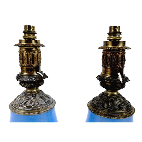 141 - A pair of Sevres style table lamps, 19th century, each porcelain base decorated with an oval reserve... 