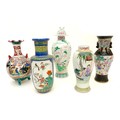 A group of Chinese vases, 20th century, including two baluster form famille rose vases, one with a d... 