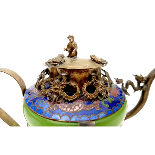 1 - Two early 20th century Chinese wine pots, both with white metal mounts and dragon form spouts, circu... 