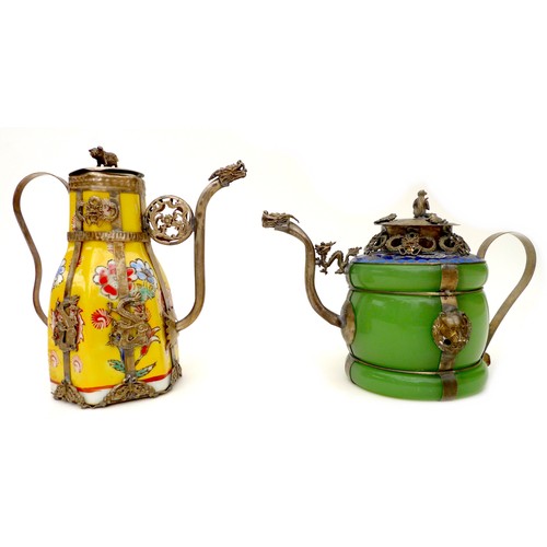 1 - Two early 20th century Chinese wine pots, both with white metal mounts and dragon form spouts, circu... 