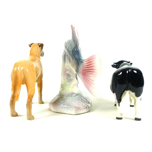 37 - A group of three figurines, comprising a Beswick 'Ch Coddington Hilt Bar' black and white cow, a Bes... 