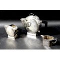 An Art Deco silver plated two piece tea set, comprising teapot, 16.5cm high, and milk jug, 10cm high... 