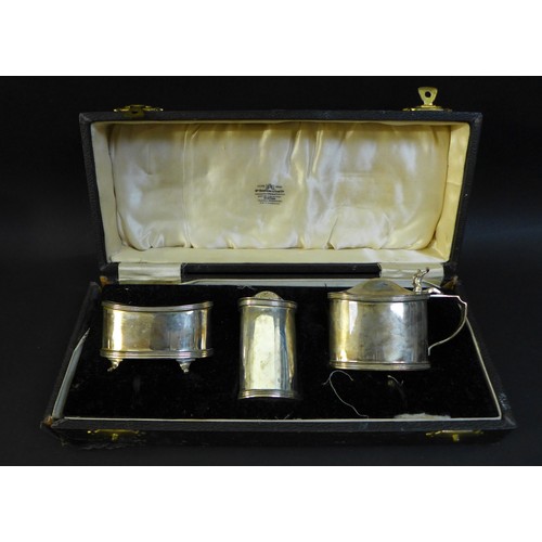 69 - A pair of matching George VI silver cruet sets, each comprising oval salt cellar with reeded rim, ov... 