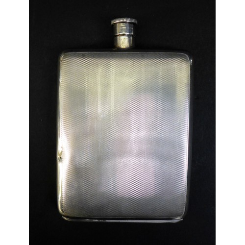 49 - Two pieces of George VI and late silver, comprising an ERII silver hip flask, with engine turned dec... 