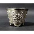 A late 19th century Chinese silver pot, the tapering quatrefoil body chased and embossed with foliat... 
