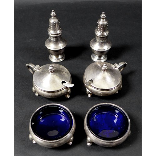 72 - Two matching Elizabeth II silver cruet sets, one set by Mappin and Webb, the other Roberts and Belk ... 