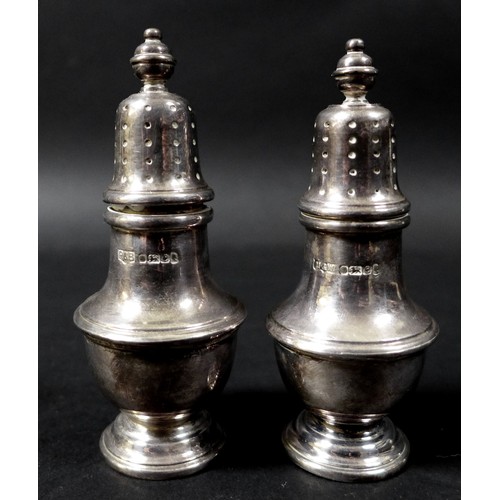 72 - Two matching Elizabeth II silver cruet sets, one set by Mappin and Webb, the other Roberts and Belk ... 