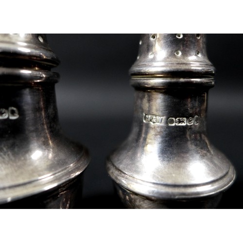 72 - Two matching Elizabeth II silver cruet sets, one set by Mappin and Webb, the other Roberts and Belk ... 