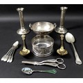 A collection of silver and plated items including a pair of silver candlesticks, modernist form with... 