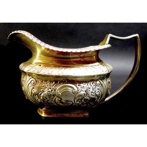 71 - A collection of Victorian and later silver, including an Edwardian silver cream jug, highly chased a... 