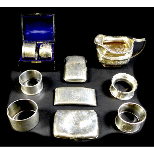 71 - A collection of Victorian and later silver, including an Edwardian silver cream jug, highly chased a... 