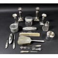 A collection of silver dressing table items, including a cylindrical glass dressing table pot, the s... 