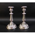 A pair of 19th century Continental white metal candlesticks, the knopped reeded columns clasped with... 