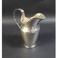 An early 19th century German silver jug, with wide lip, loop handle, and slender decorative borders,... 