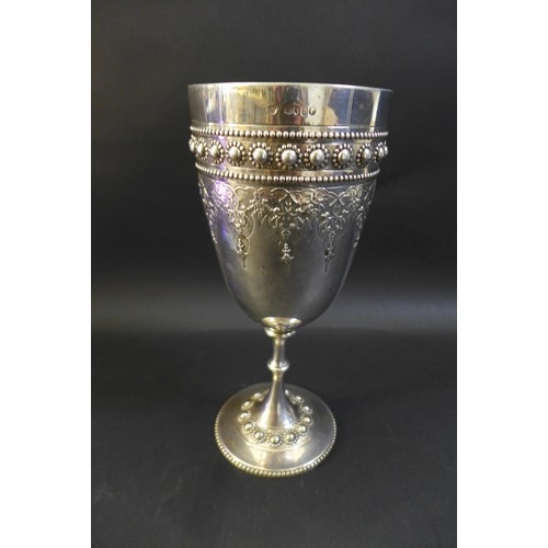 63 - A Victorian silver goblet, ornately decorated with a blank cartouche and profuse beaded decoration, ... 