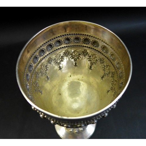 63 - A Victorian silver goblet, ornately decorated with a blank cartouche and profuse beaded decoration, ... 