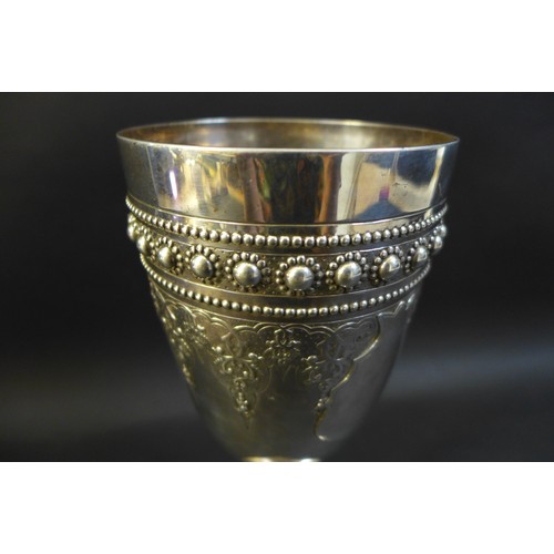 63 - A Victorian silver goblet, ornately decorated with a blank cartouche and profuse beaded decoration, ... 