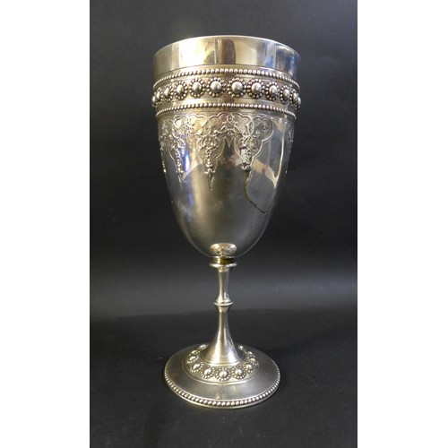 63 - A Victorian silver goblet, ornately decorated with a blank cartouche and profuse beaded decoration, ... 